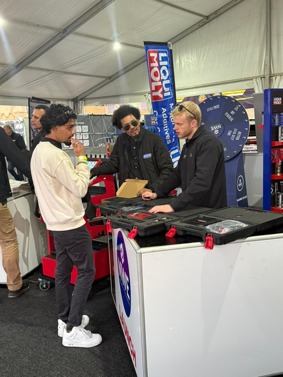 NWE Team with Customer at IDLE Auto Expo